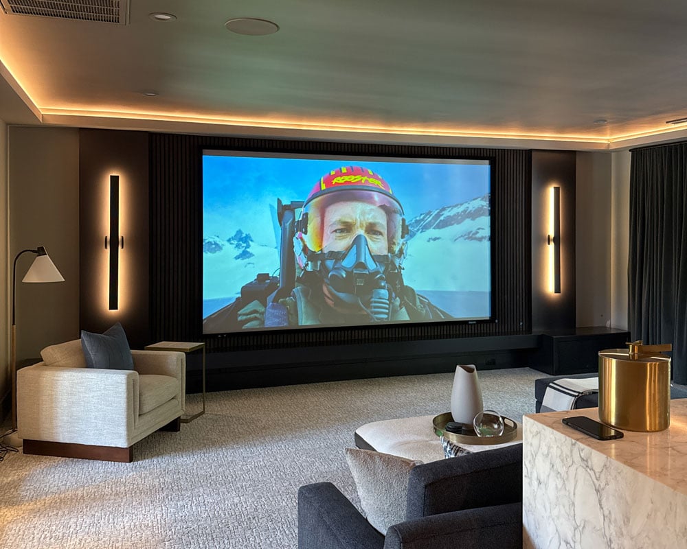 Home theater screen and seating area in smart home